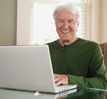 Older man using laptop